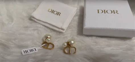 dior earrings real or fake|is dior jewelry real.